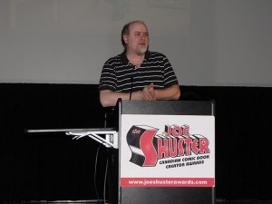 Ty Templeton presents the award for Outstanding Cartoonist