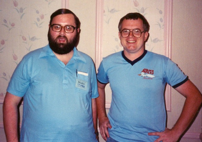 The only known photo of Jim Burke (left), taken with friend Russ Maheras at the 1988 Chicago Comic-Con. Burke was at the show promoting his comic, Captain Optimism.